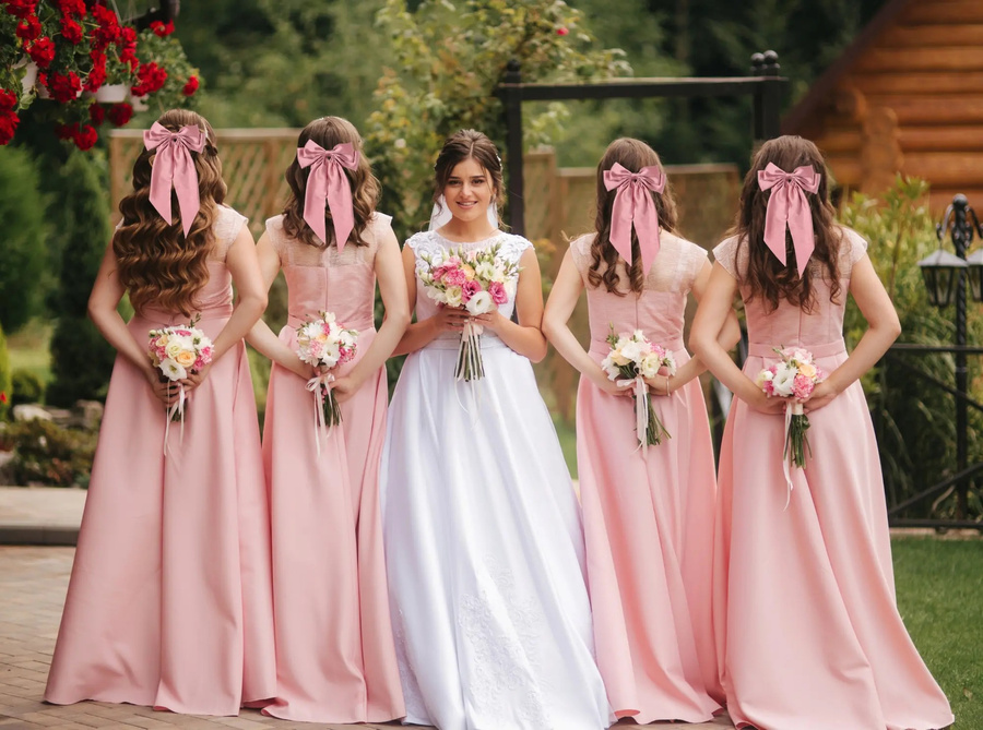 Ozdobna kokarda do włosów na spince różowa