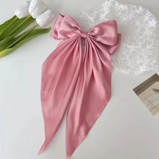 Ozdobna kokarda do włosów na spince różowa